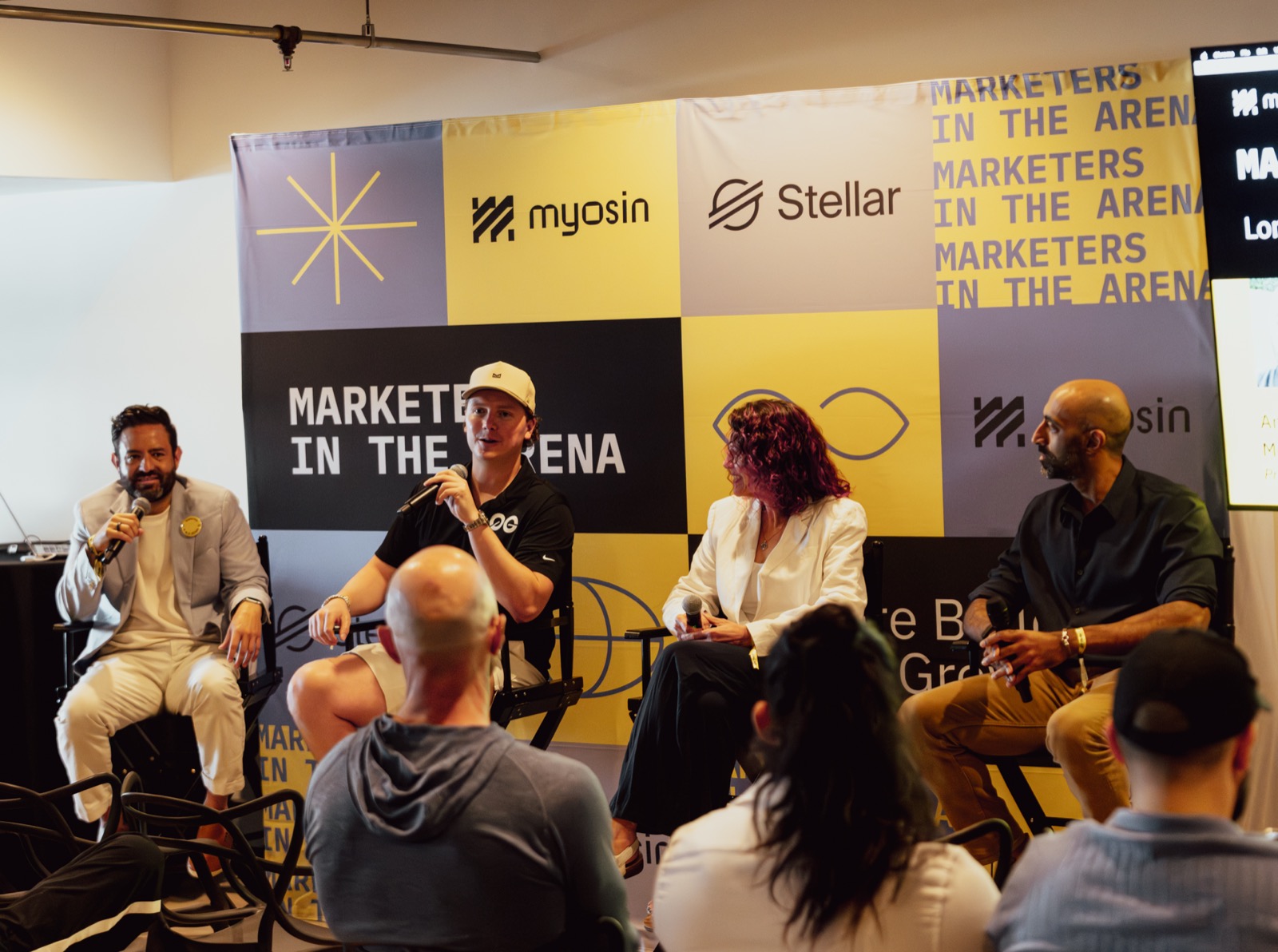 Jake Salerno on the Marketers in the Arena panel during Consensus Miami 2026, myosin and Stellar logos behind the stage